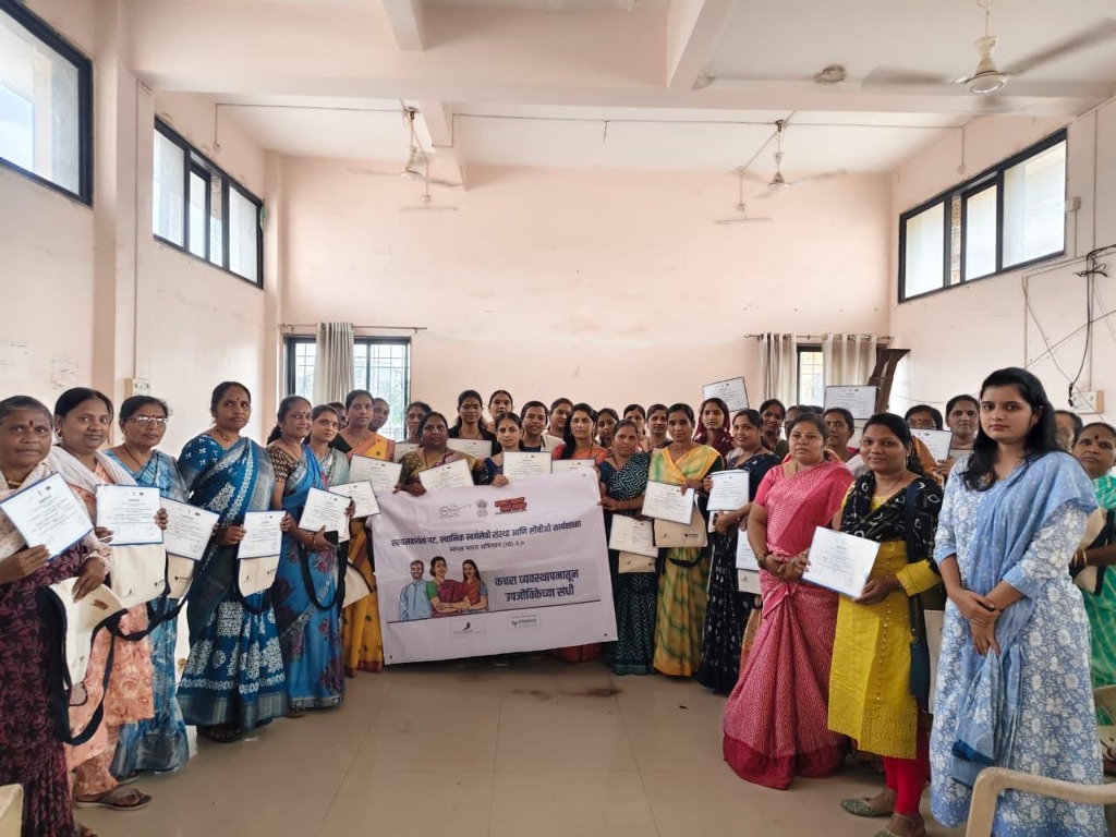 Women receiving training certificates at AMRUT-SAKSHAM workshop